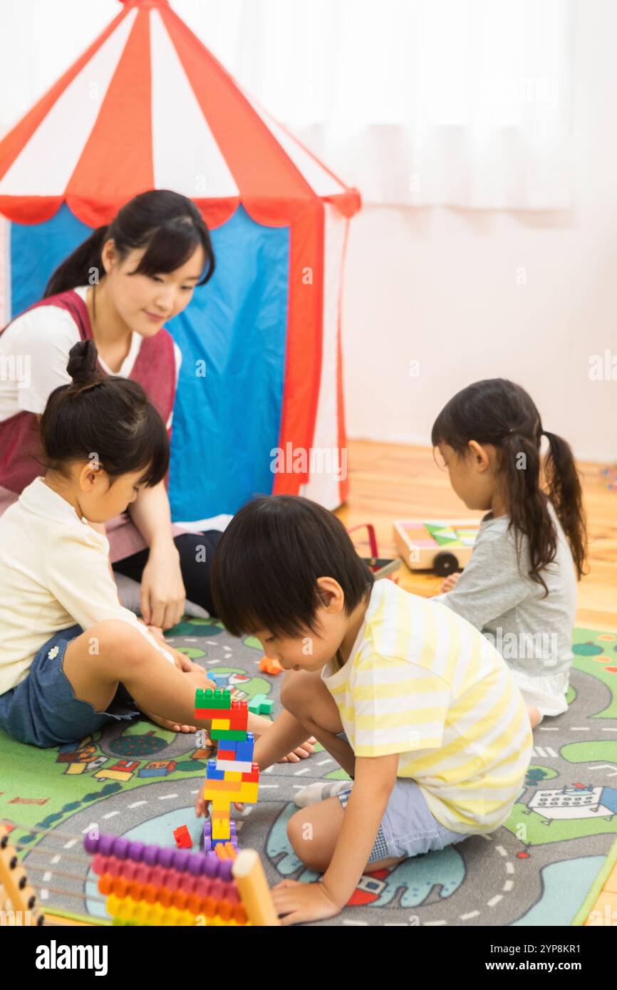 School children playing with toys Stock Photo - Alamy