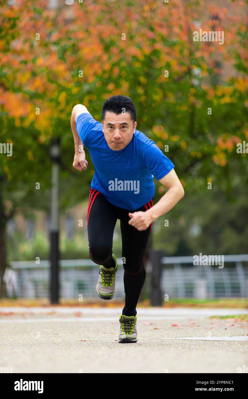 Running middle man Stock Photo - Alamy