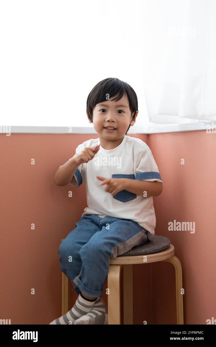 Boy stool studio hi-res stock photography and images - Alamy