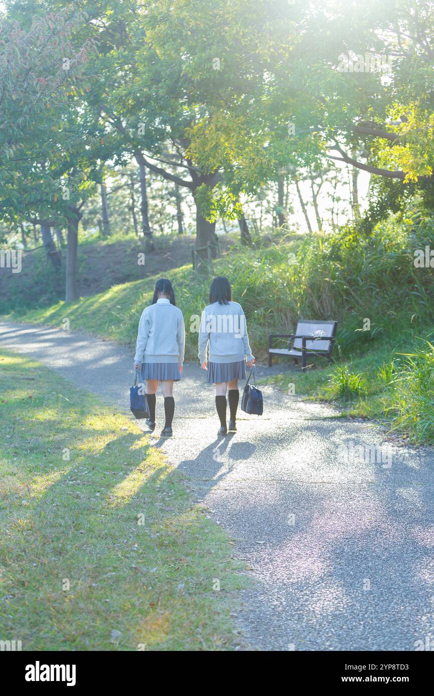 Two girls walk school in hi-res stock photography and images - Alamy