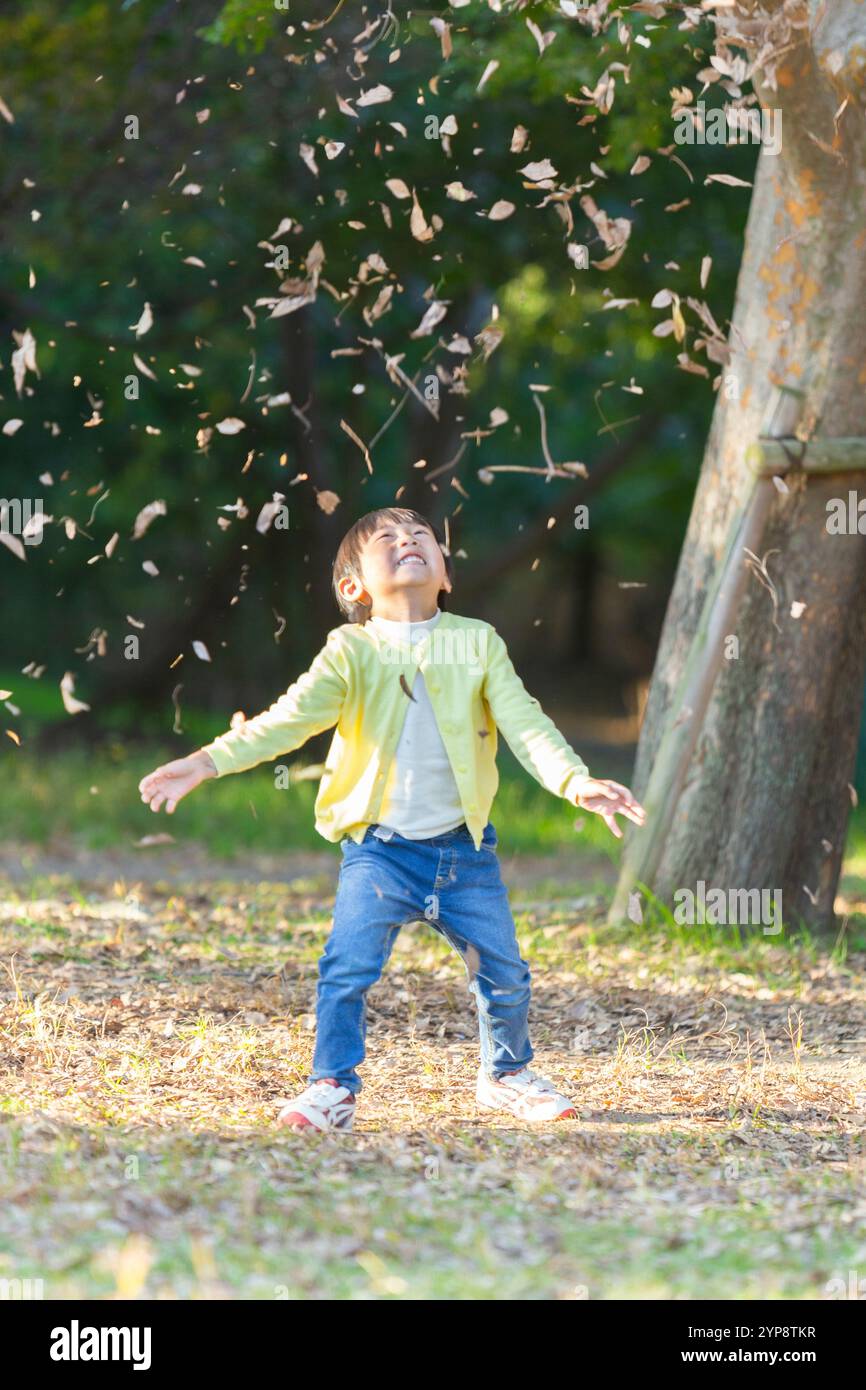 Boy playing in park hi-res stock photography and images - Alamy