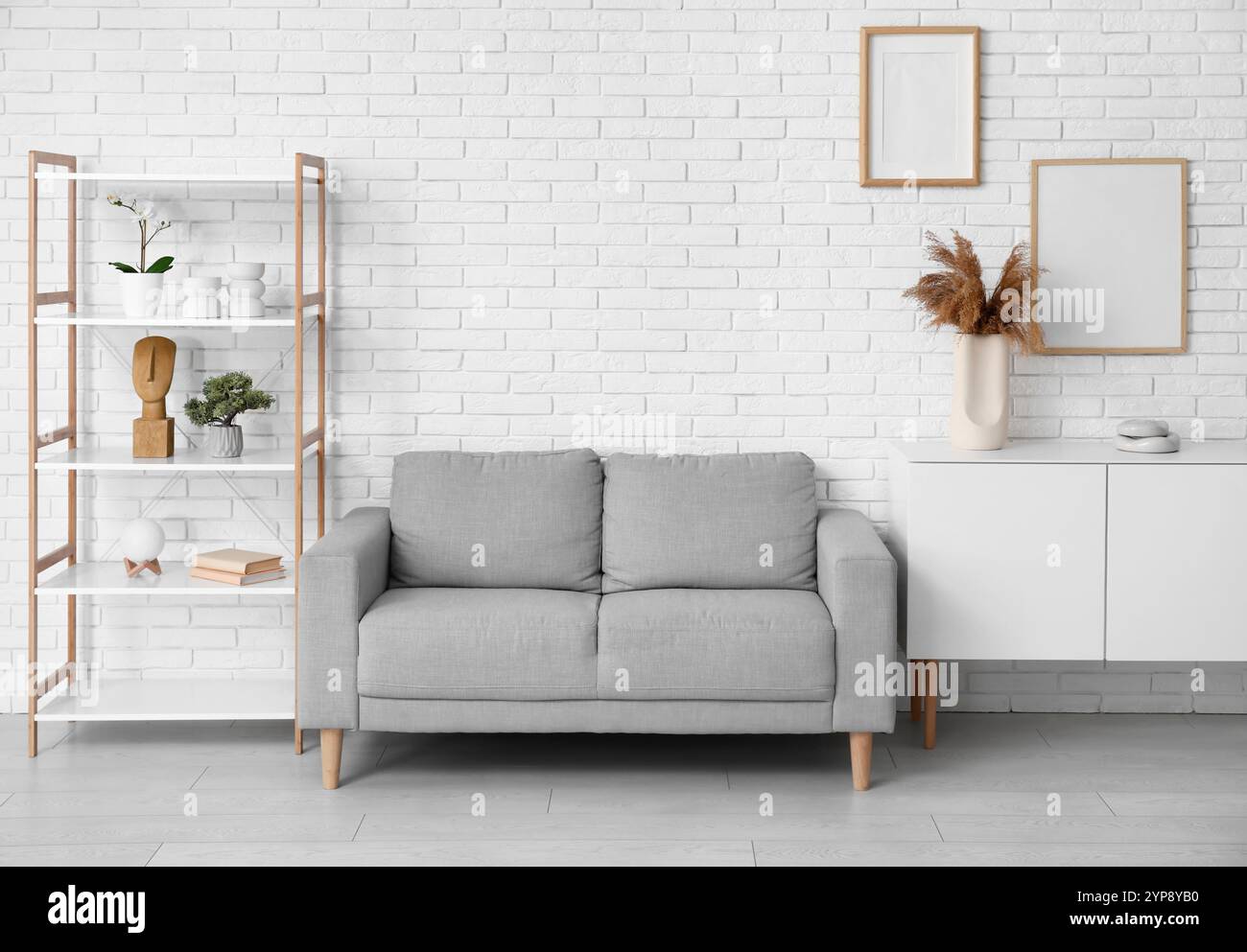 Modern interior of living room with grey sofa Stock Photo - Alamy