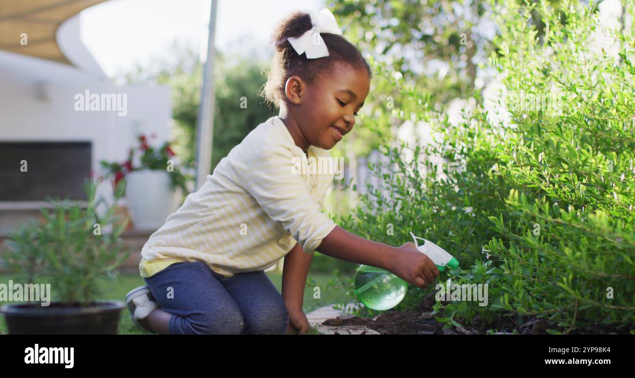 Happy african amercian girl gardening hi-res stock photography and ...