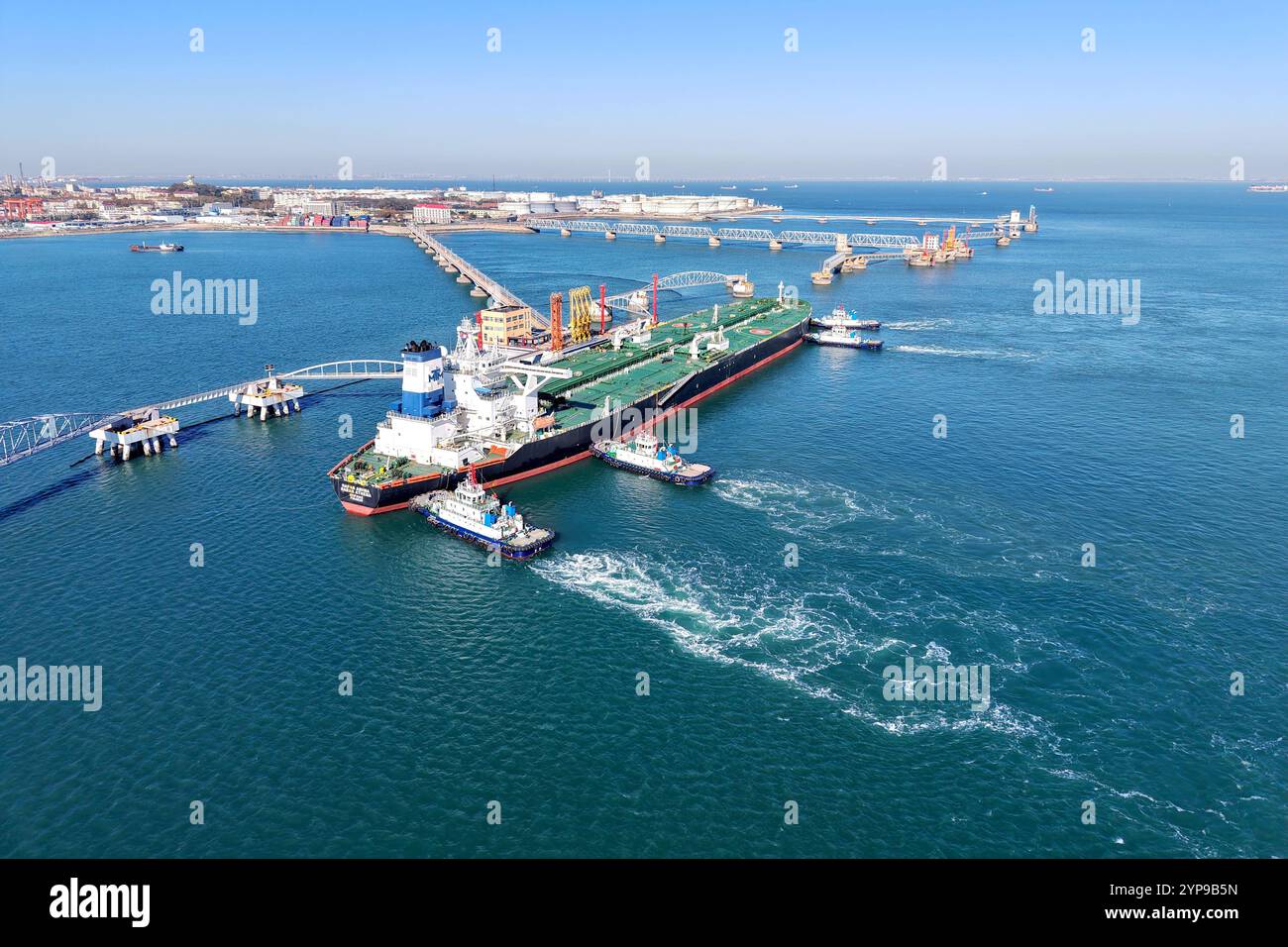 QINGDAO, CHINA - NOVEMBER 29, 2024 - A foreign oil tanker prepares to leave the dock after unloading crude oil at the port of Qingdao, Shandong provin Stock Photo