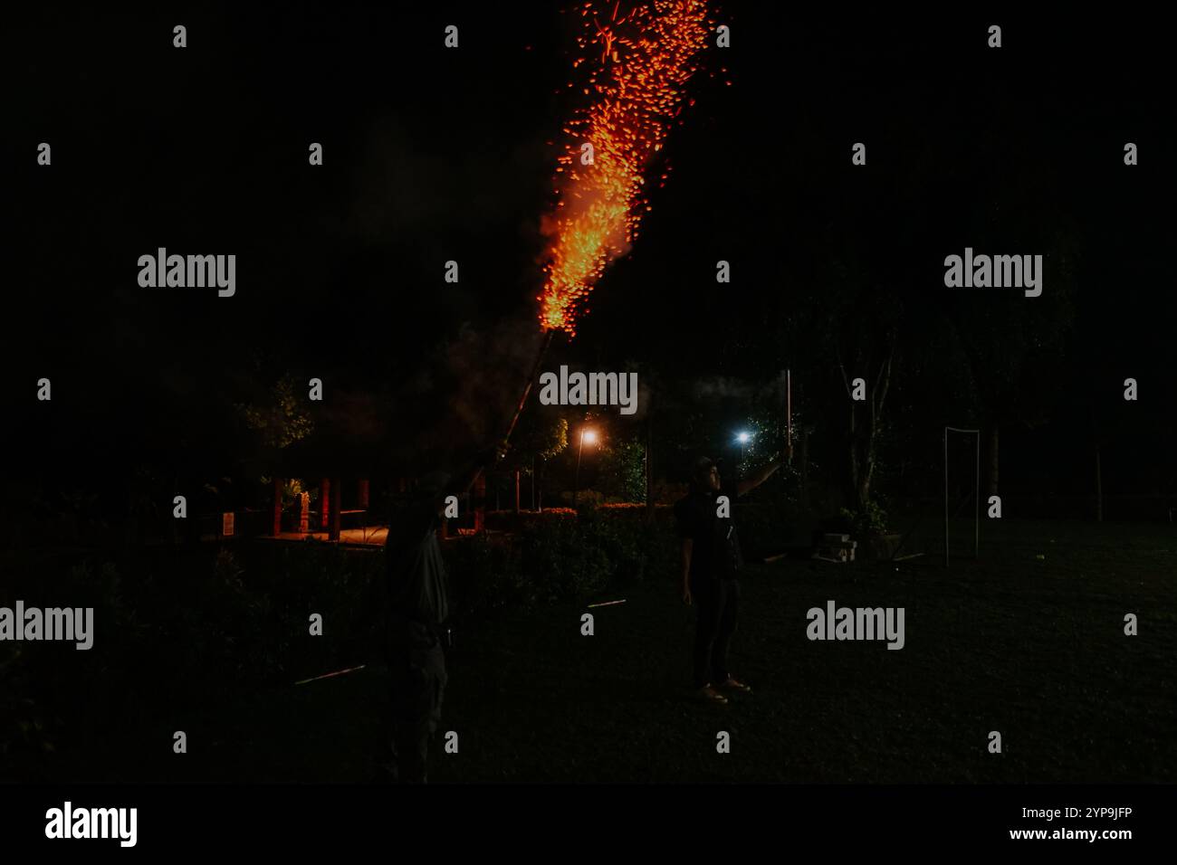 Roaring Rockets Display Firework rockets launched into the night sky, creating a vibrant and ...