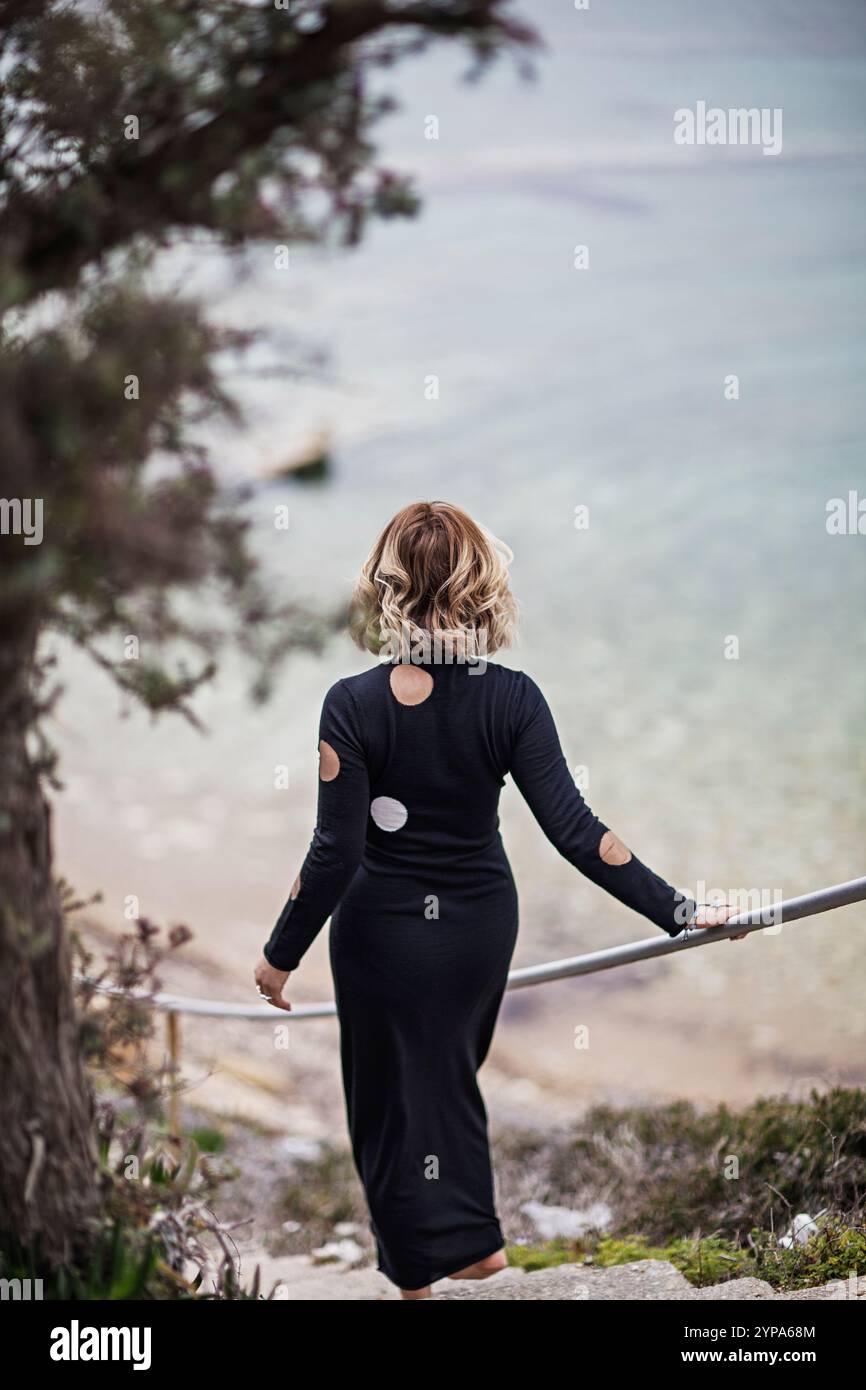 Female dress sea rear view hi-res stock photography and images - Alamy