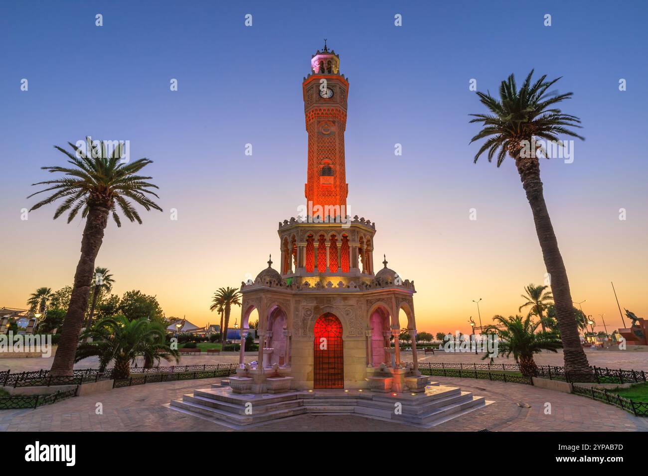 Clock Tower at night with intricate design and distinctive architecture draw both locals and tourists in Izmir, Turkey. Popular meeting point and wash Stock Photo