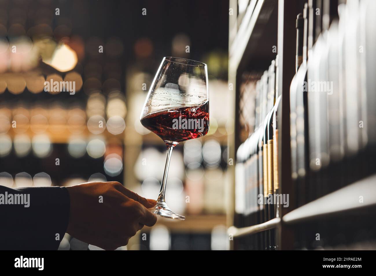 Sommelier evaluates red wine hi-res stock photography and images - Alamy