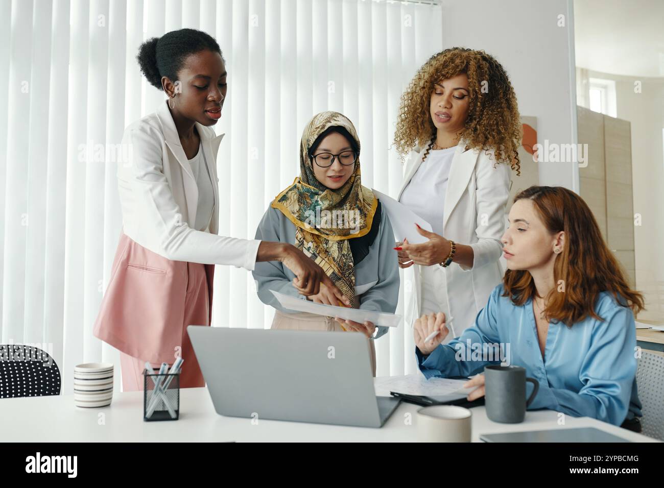 Diverse Group Discussing Business Strategy in Office Stock Photo