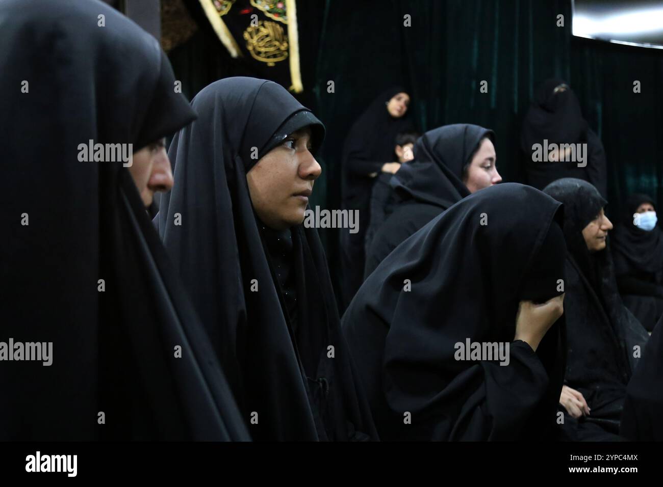 Tehran, Iran. 29th Nov, 2024. Iranians veiled women mourn during the funeral ceremony of Brigadier General Kiyomarth Porhashmi, a senior officer of the Islamic Revolutionary Guard Corps (IRGC) Quds Force, who was killed in Aleppo, Syria. The IRGC Quds Force is a unit of Iran's Revolutionary Guard that conducts military, intelligence, and support operations abroad to advance Iran's regional influence. (Credit Image: © Rouzbeh Fouladi/ZUMA Press Wire) EDITORIAL USAGE ONLY! Not for Commercial USAGE! Stock Photo