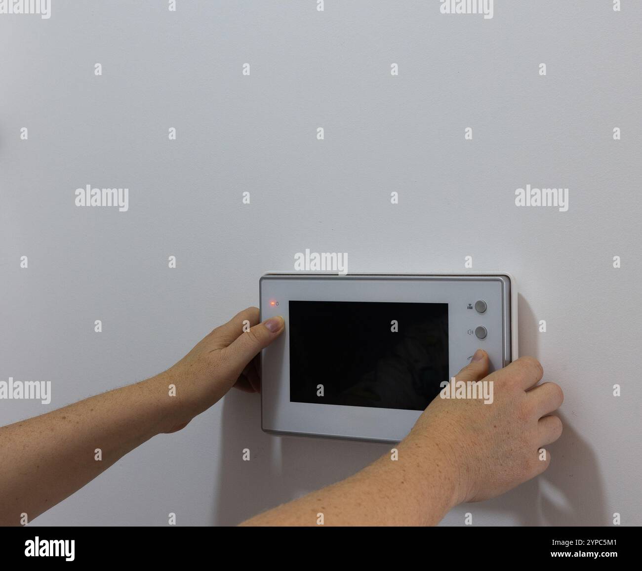 Technical maintenance and setup of a Home Intercom System Stock Photo