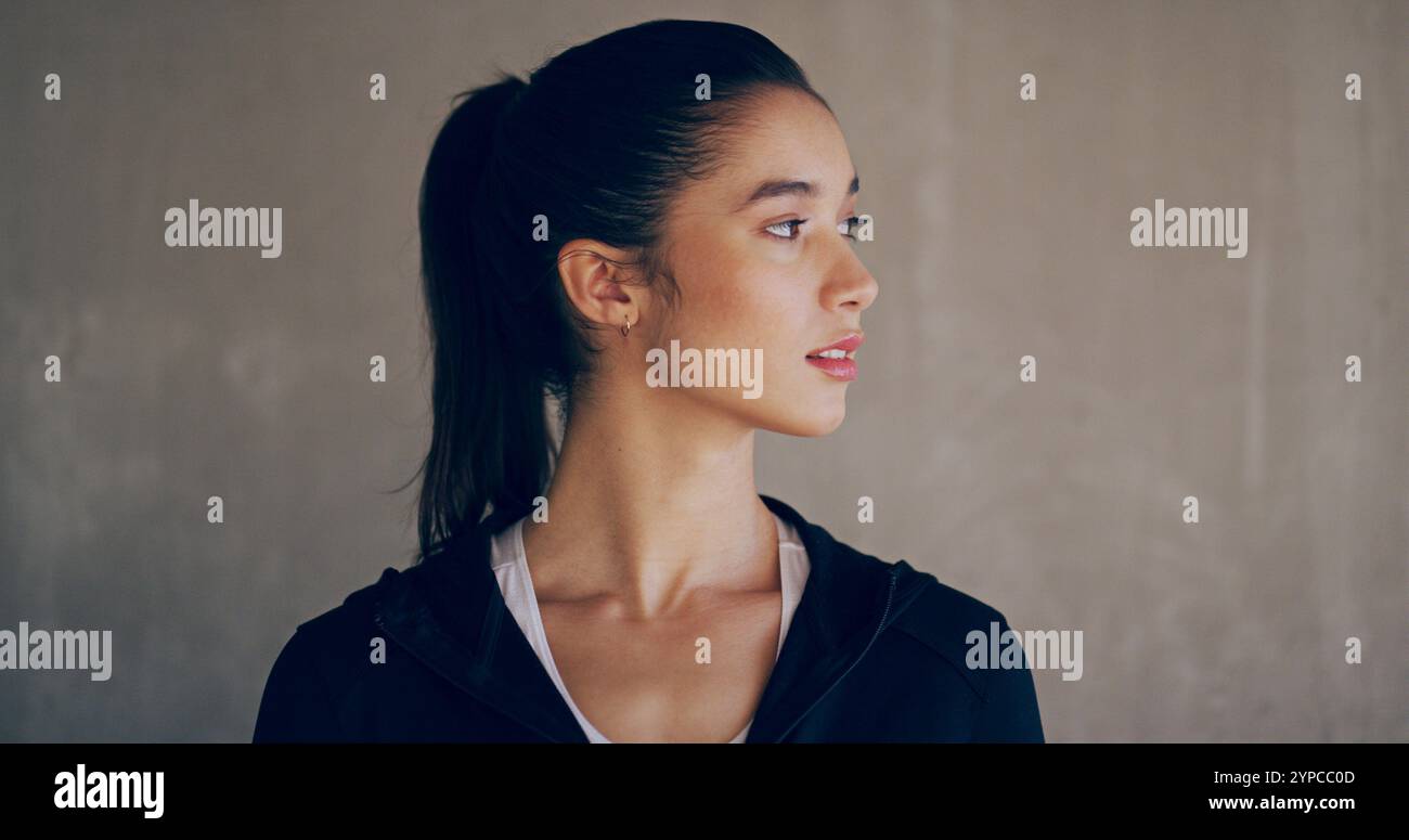 Sportswear, woman and thinking of fitness, wall and mindset workout ...