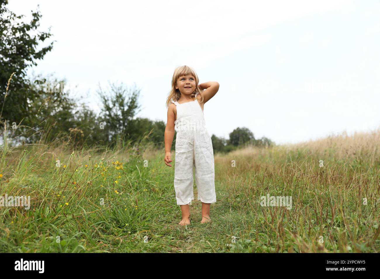 Cute Little Girl Walking Barefoot At Meadow Child Enjoying Beautiful cute-little-girl-walking-barefoot-at-meadow-child-enjoying-beautiful
