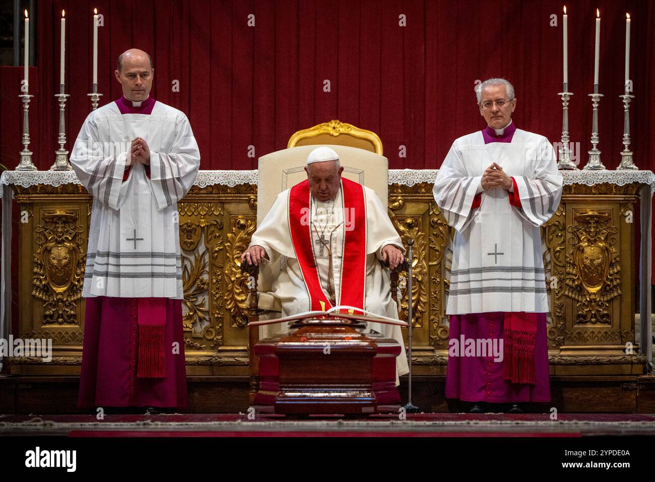Pope Francis, flanked by his aides, Archbishop Diego Giovanni Ravelli ...