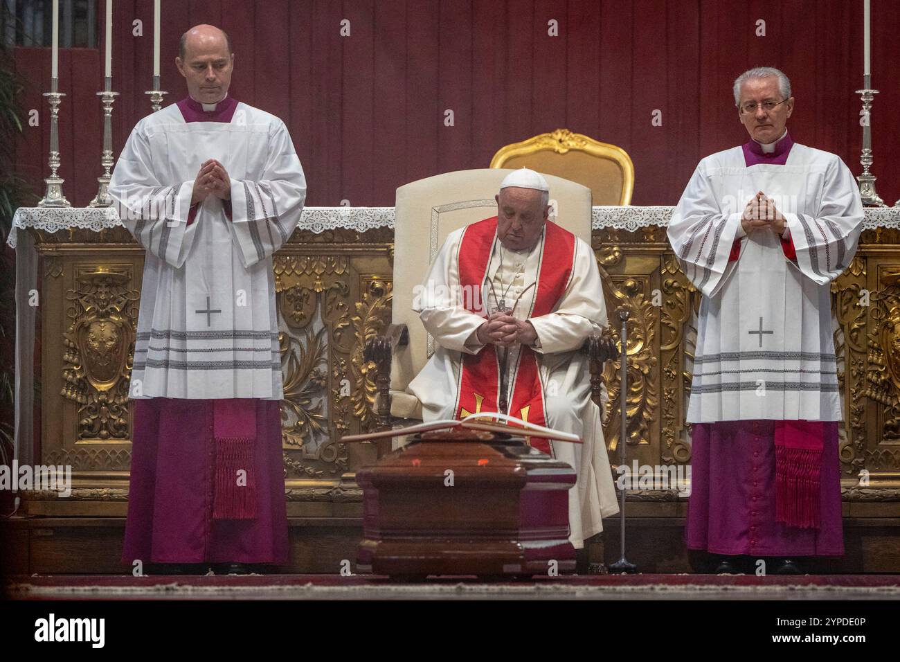 Pope Francis, flanked by his aides, Archbishop Diego Giovanni Ravelli ...