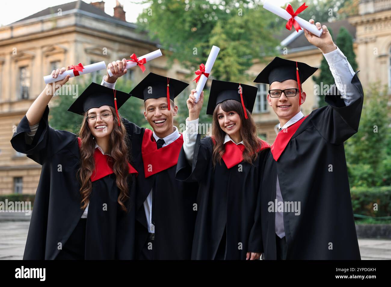 After Graduation Image Happy students with diplomas after graduation ceremony outdoors Stock ...