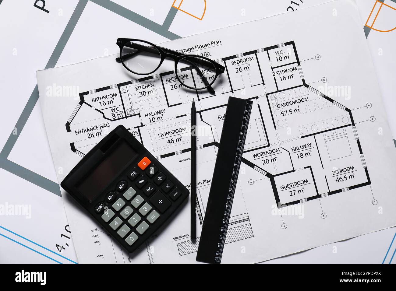 Glasses, calculator and ruler on different architectural drawings, flat ...