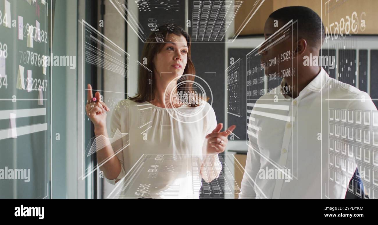 Analyzing data on screen, business professionals with futuristic interface image Stock Photo