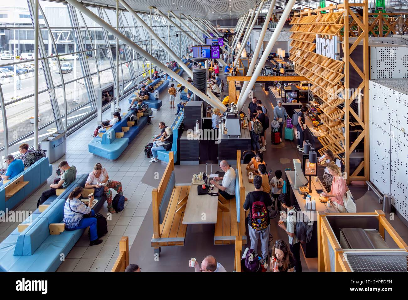 Passengers in terminal building at Schipol International Airport, Amsterdam, Holland Stock Photo