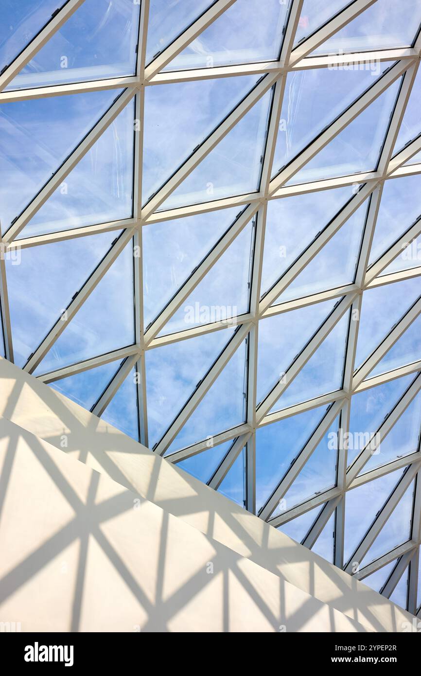 Lightning Layout Mall Glass roof of the mall inside view with part of white concrete wall and ...