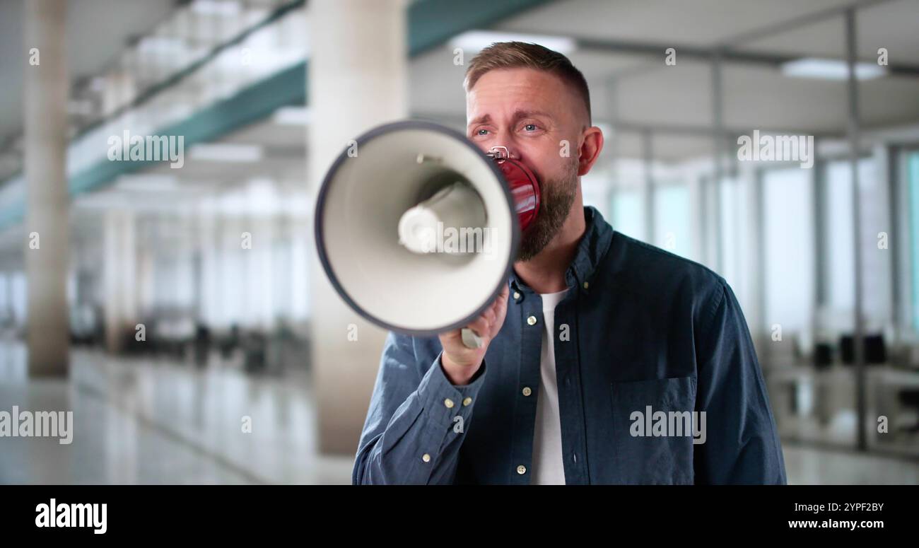 Man Making Megaphone Announcement. Warning Concept Speaker Stock Photo