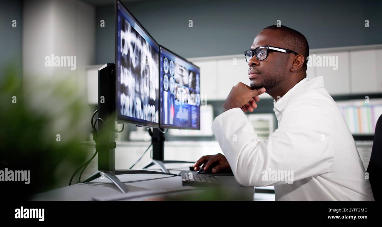 Dentist Doctor Looking At Teeth Xray On Computer Stock Photo