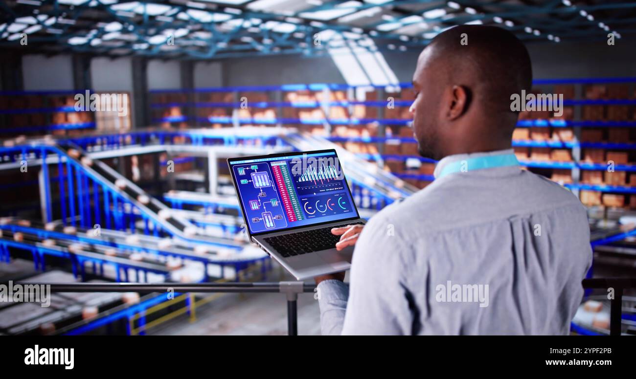 Engineer Worker Using Warehouse Automation Dashboard In Logistic Center Stock Photo