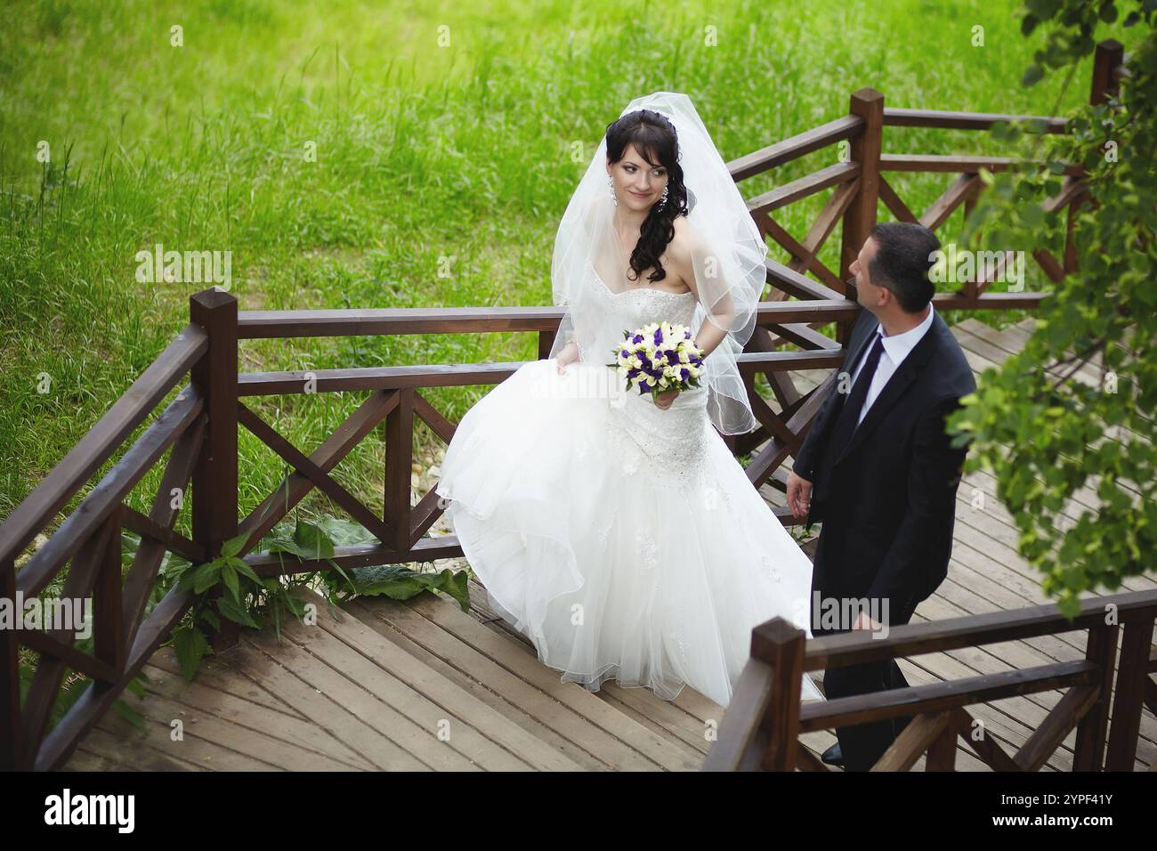 Bride descending stairs hi-res stock photography and images - Alamy