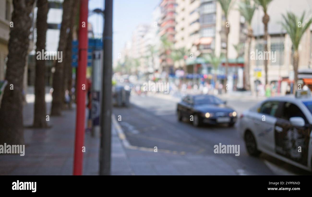 Blurred outdoor scene with defocused background featuring a busy street ...