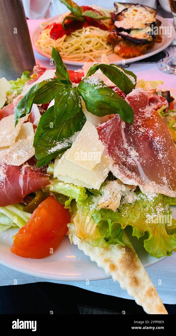 A Burrata Salad with Lettuce, Tomato and Parmesan - Smartphone Captured Stock Image