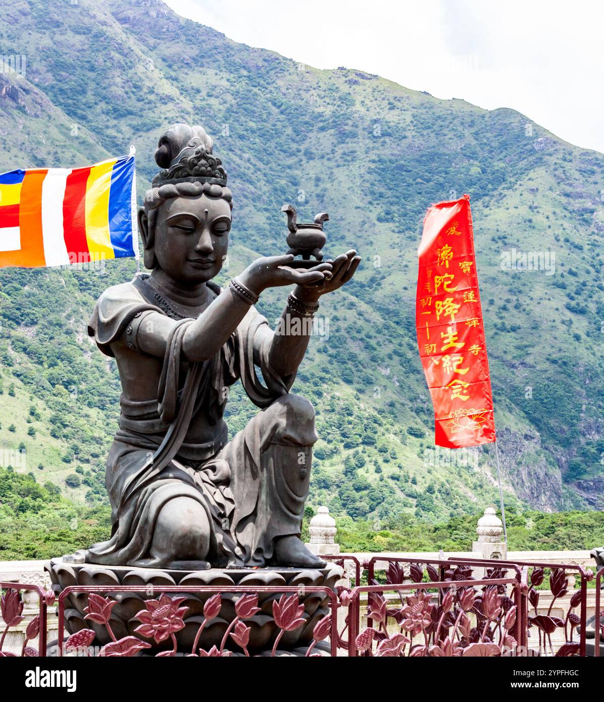At the same site as the Big Buddah The Offering of the Six Devas that are posed offering flowers, incense, lamp, ointment, fruit, and music to the Bud Stock Photo