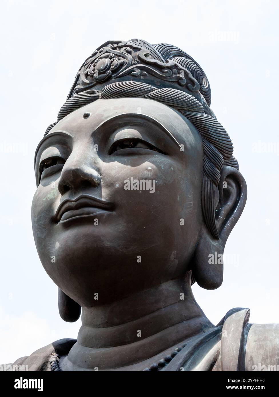 At the same site as the Big Buddah The Offering of the Six Devas that are posed offering flowers, incense, lamp, ointment, fruit, and music to the Bud Stock Photo