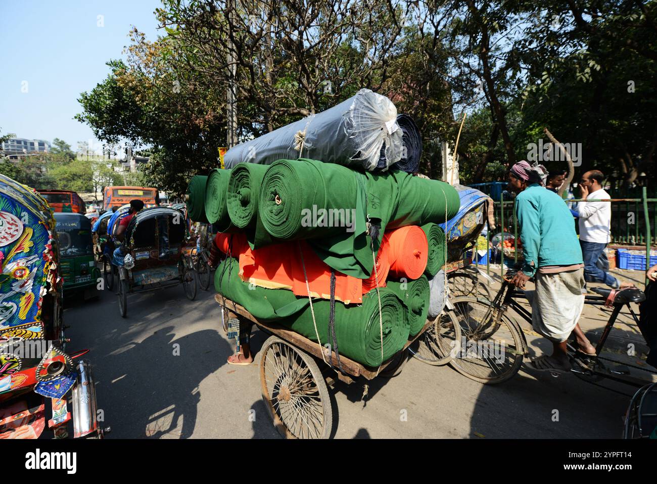 Colorful cycle rickshaws roaming the streets of Dhaka, Bangladesh Stock ...