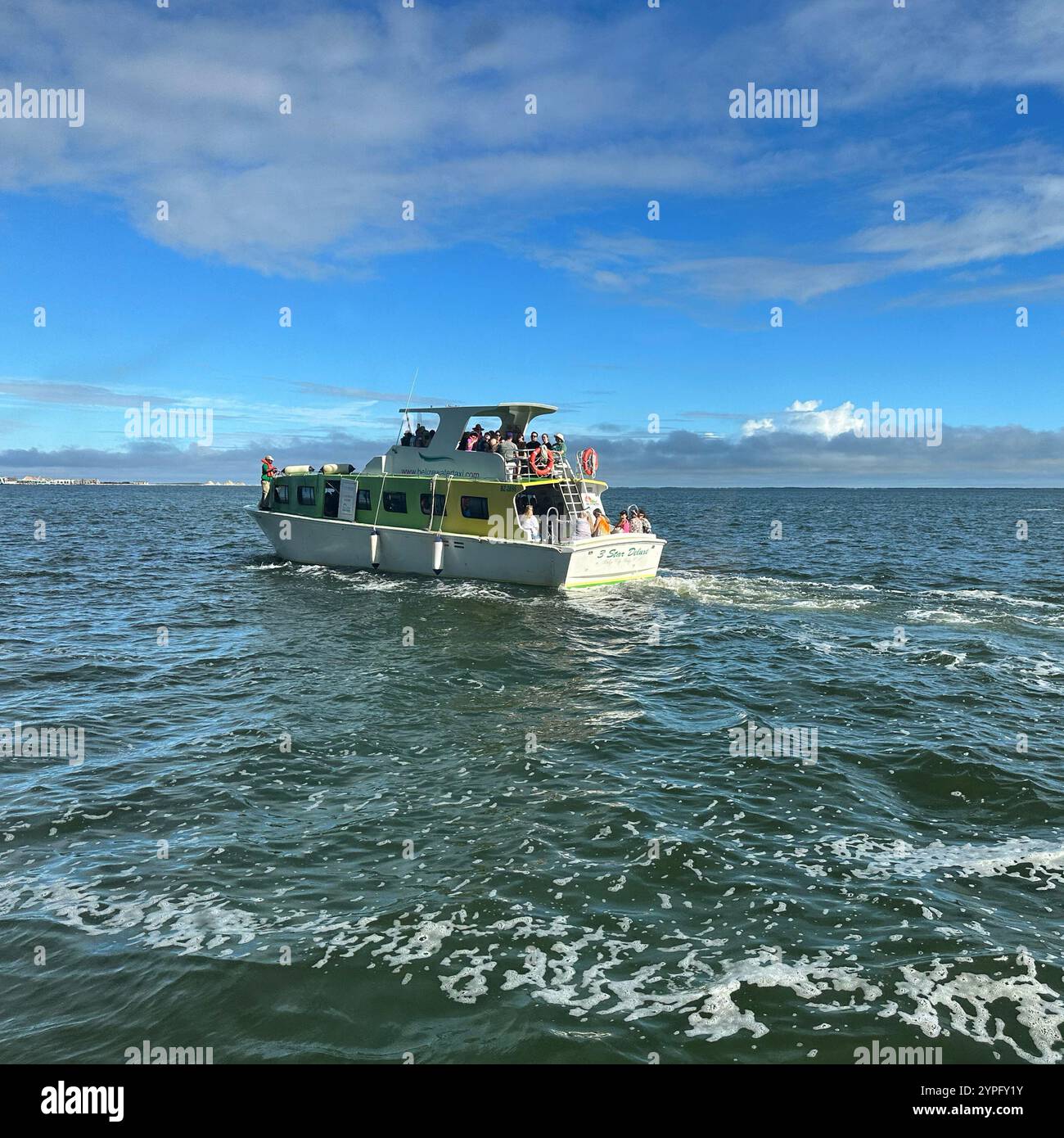 Tender boat on its way from a cruise ship to the port at Belize City, Belize, Central America, November, 2023 - Smartphone Captured Stock Image
