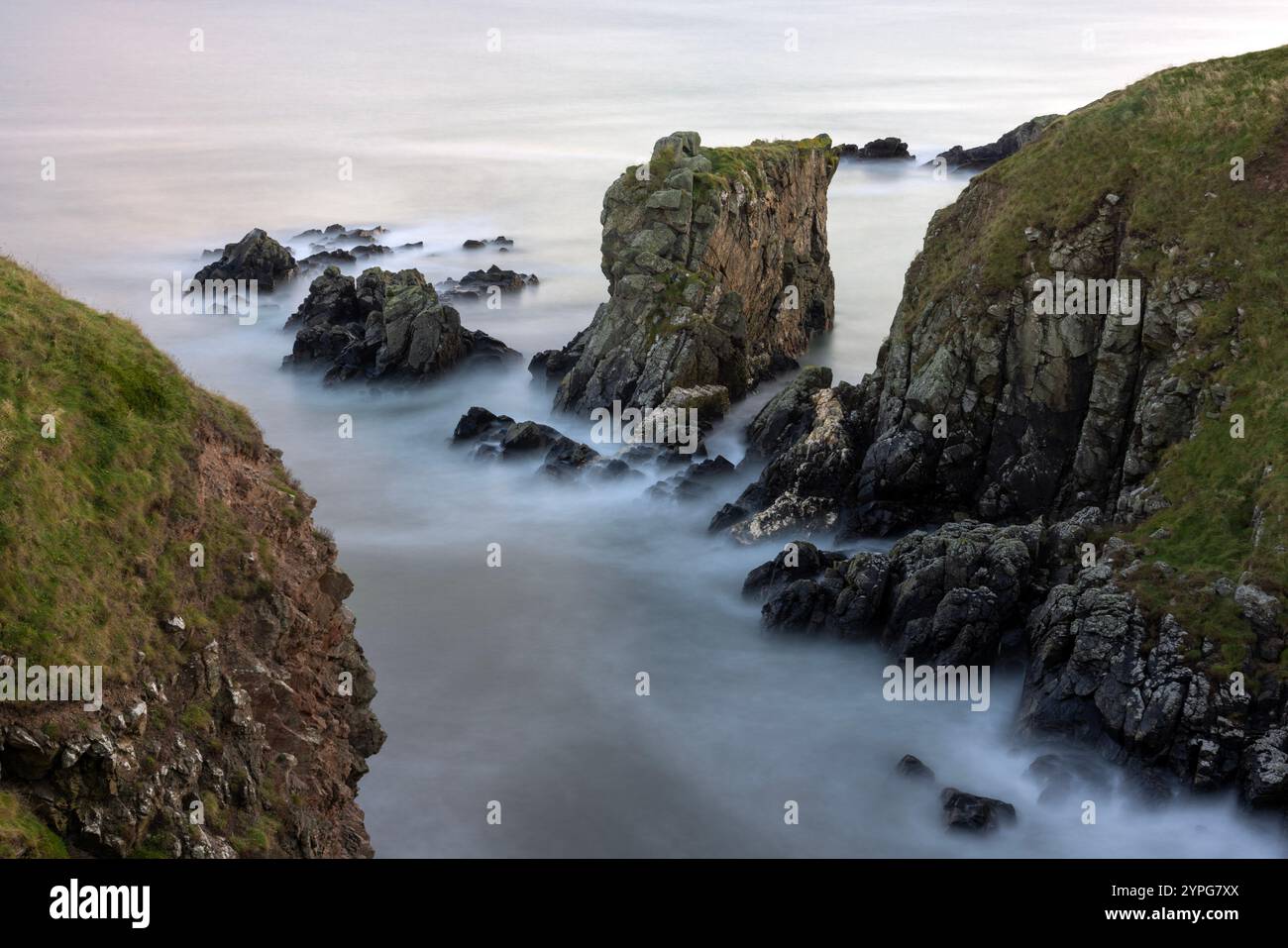 In Aberdeenshire, Scotland, the Aberdeen Coastal Path offers a scenic hiking experience, stretching south of Aberdeen toward the picturesque Cove Bay. Stock Photo