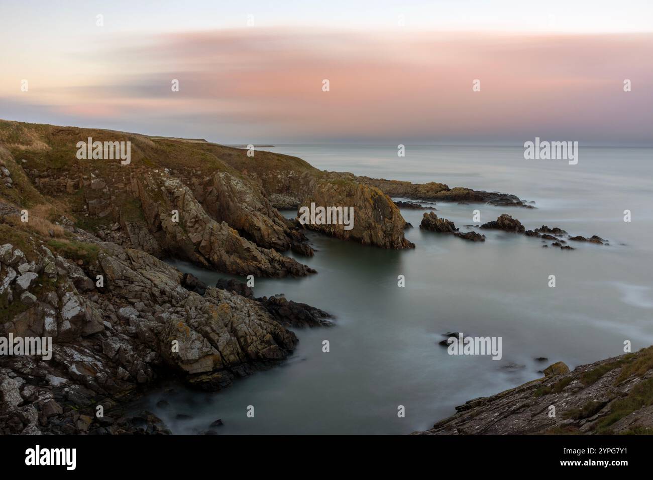 In Aberdeenshire, Scotland, the Aberdeen Coastal Path offers a scenic hiking experience, stretching south of Aberdeen toward the picturesque Cove Bay. Stock Photo
