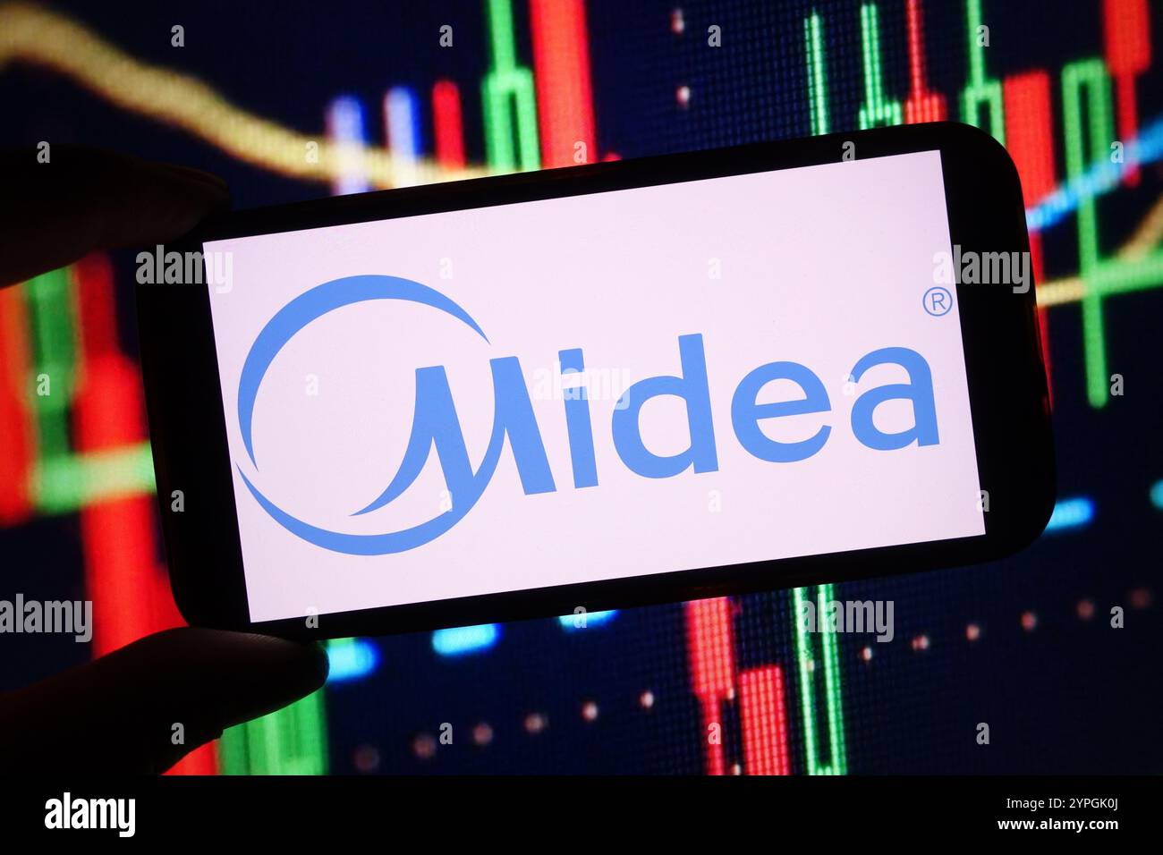 In this photo illustration, the Midea company logo is seen displayed on ...