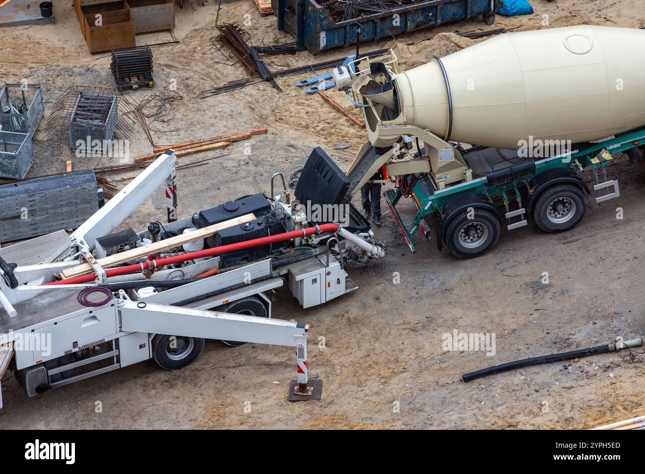 cement mixer fills concrete pump Stock Photo - Alamy