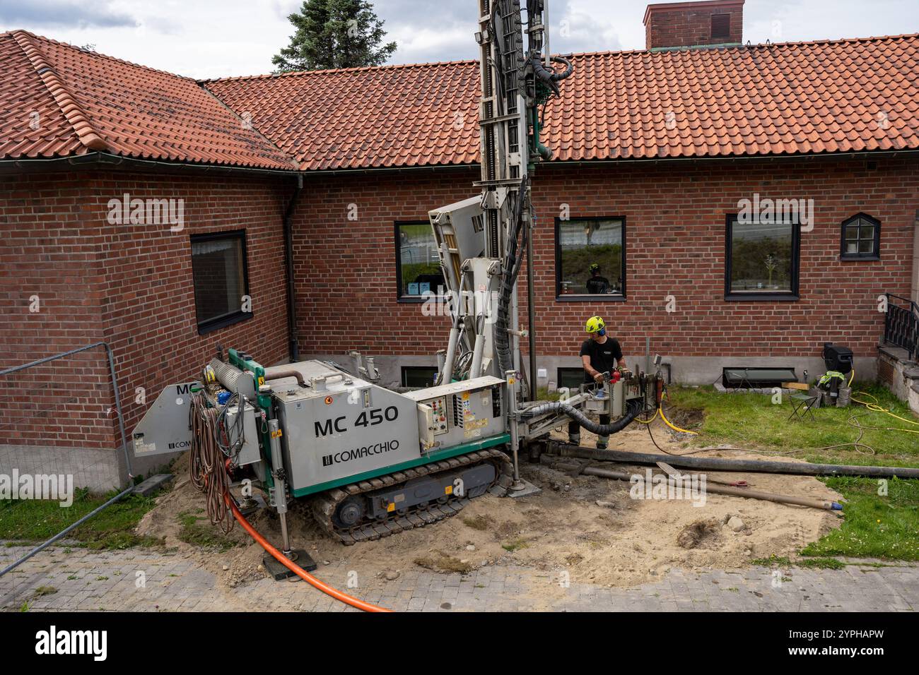 Narvik, Norway - 07.05.2024: Man operating CH 450 Comacchio drilling rig Stock Photo