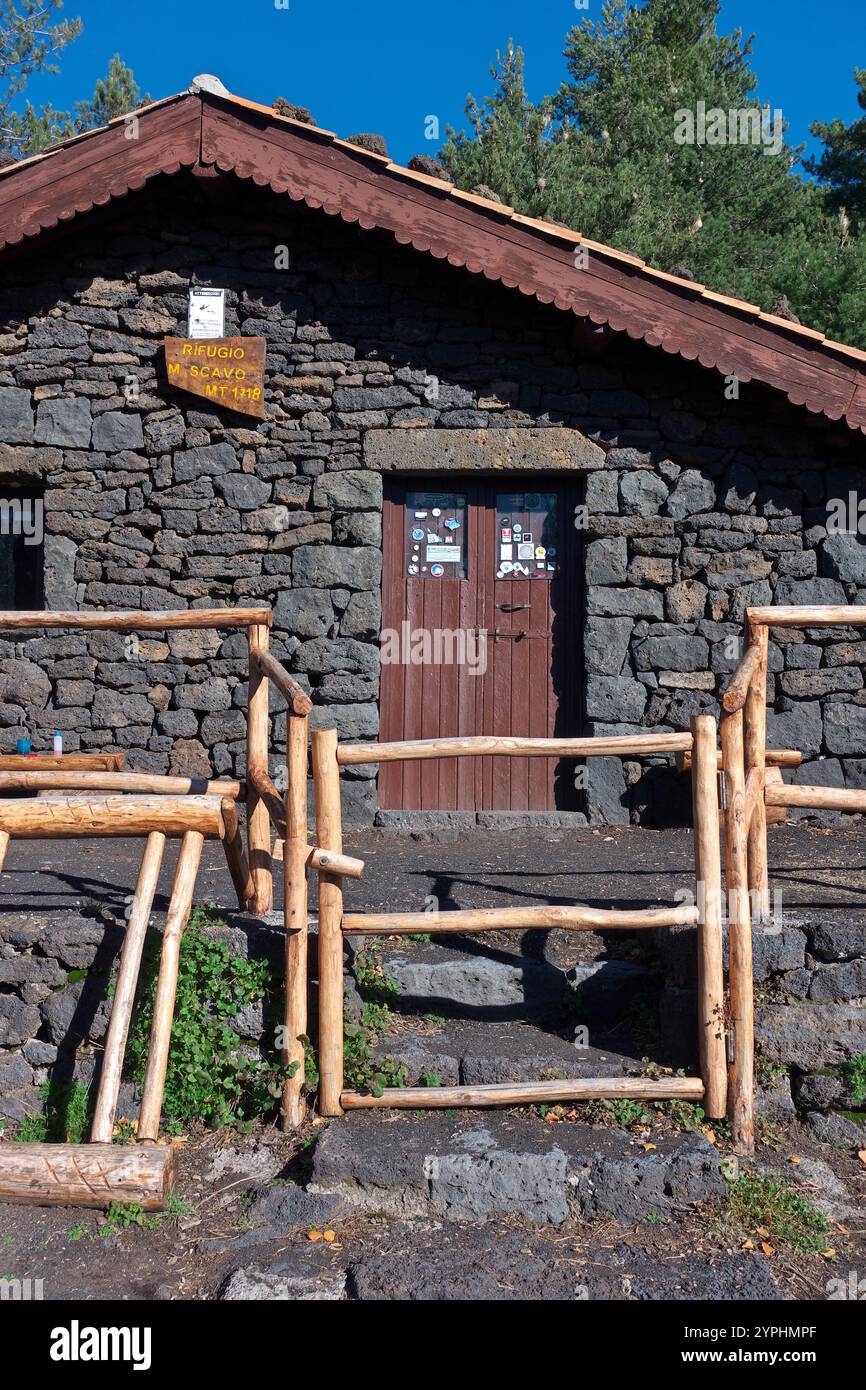 refuge of 'Monte Scavo' with wooden fence along path 'Pista Altomontana' in Etna Park, Sicily, Italy Stock Photo