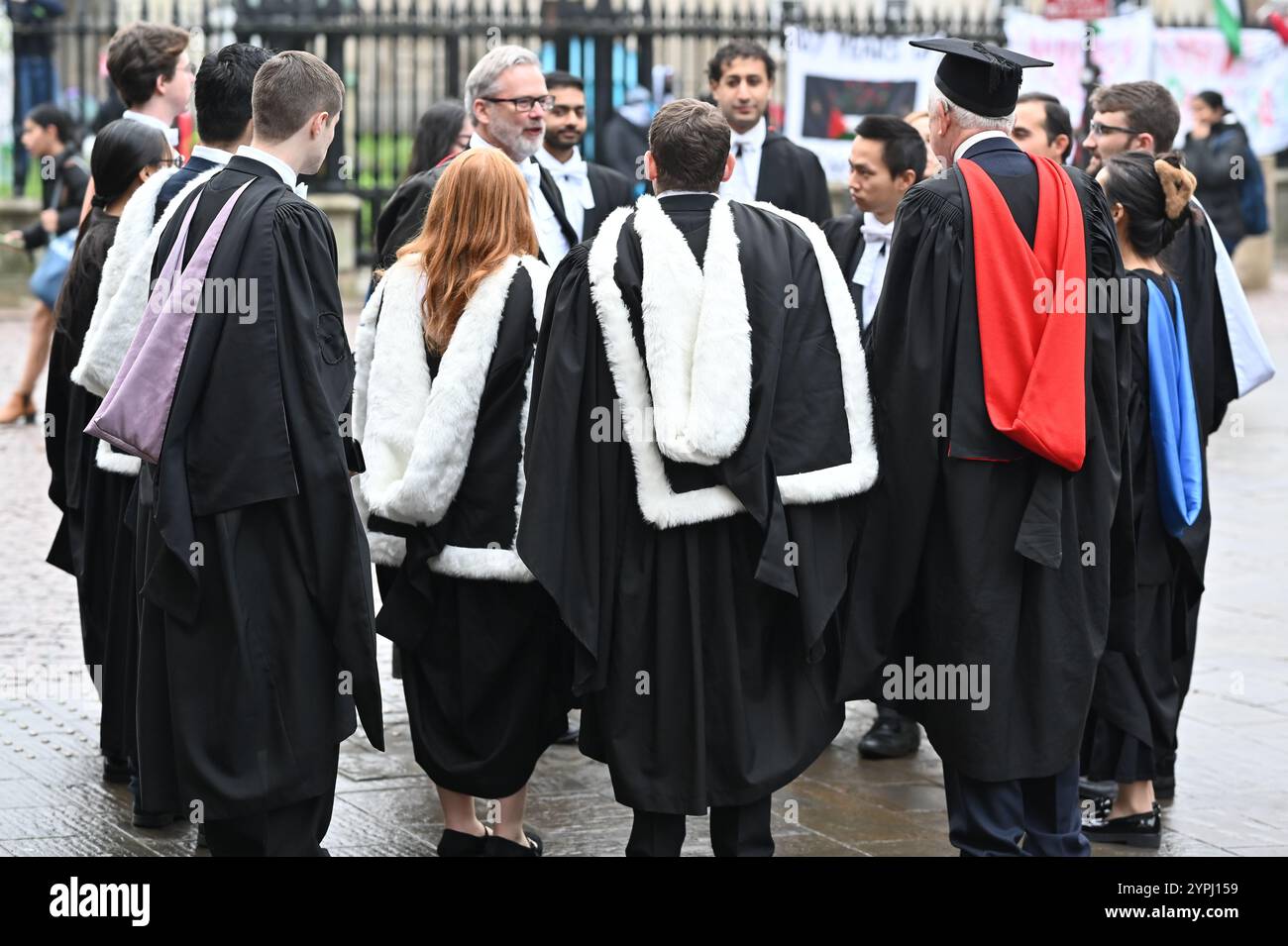 Cambridge, England, 30 November 2024, UK. Students gather on Kings ...