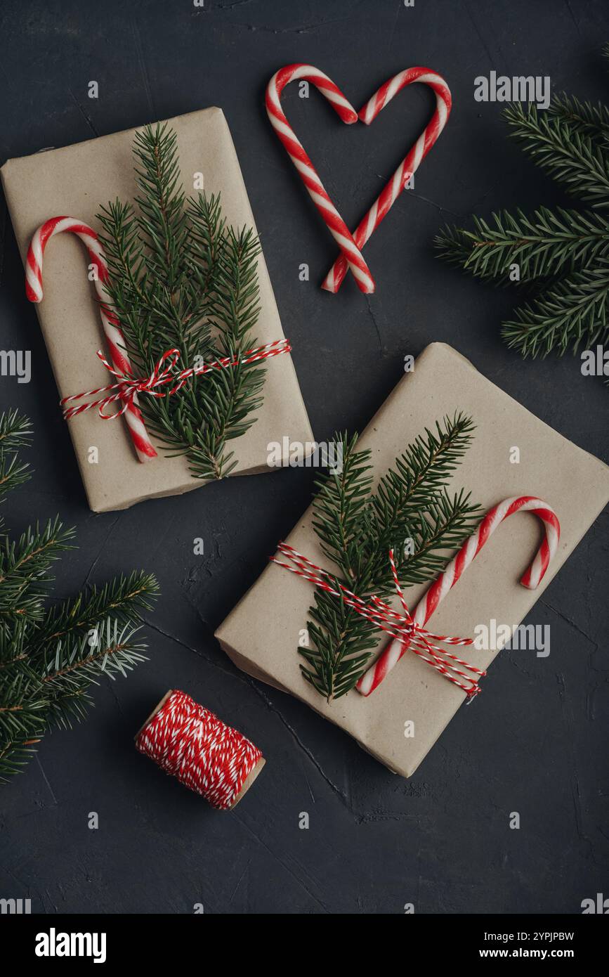 Christmas background. Gift boxes in craft paper with candy canes and ...