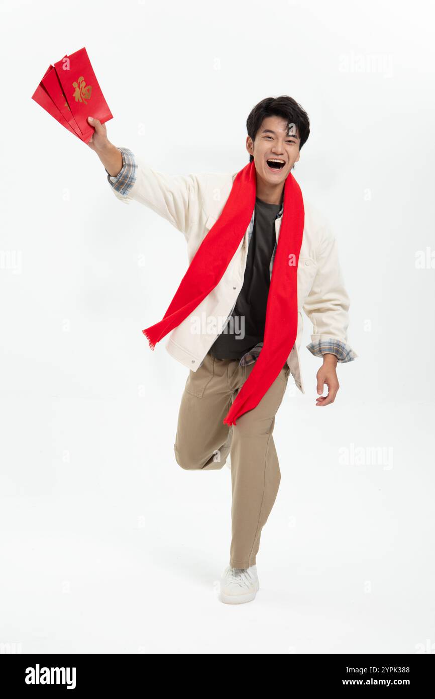 Young Asian man holding Chinese red lantern Stock Photo