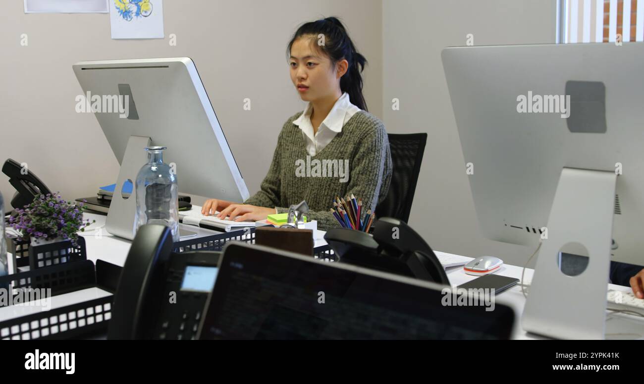 Asian female entrepreneur working on hi-res stock photography and ...
