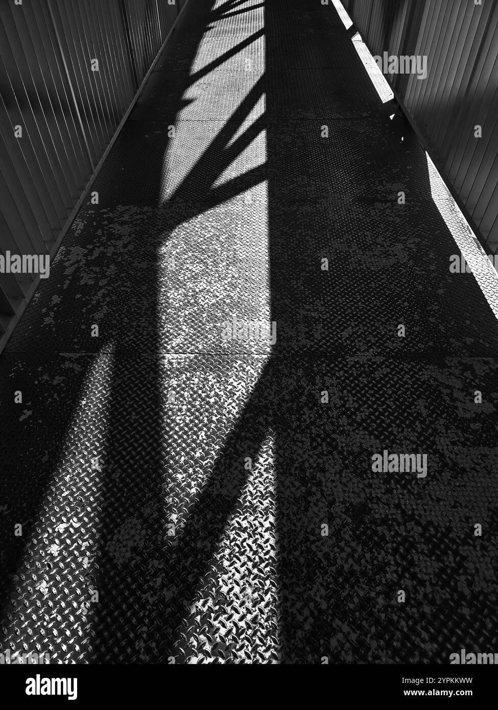 Abstract Shadows and Textures on an Industrial Walkway concept Stock Photo