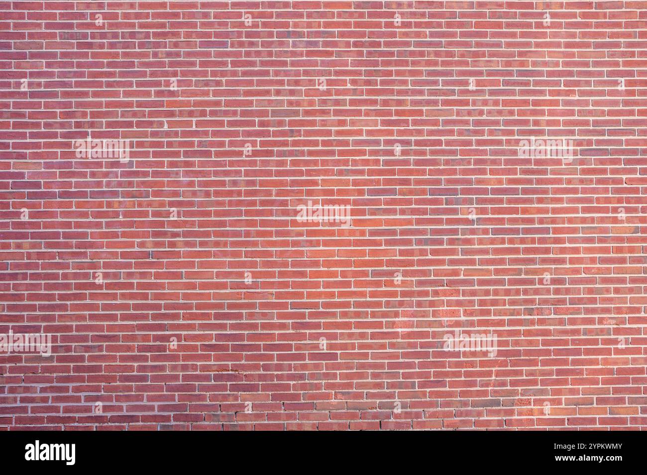 Background from a large wall made of red bricks Stock Photo