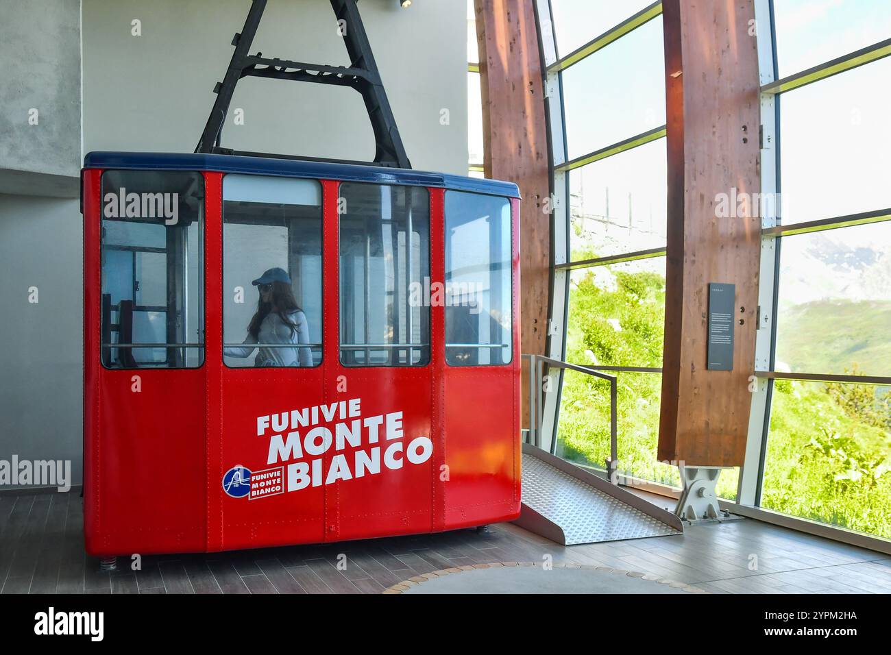 A vintage cable car of the Funivie Monte Bianco inside the modern Skyway Monte Bianco cableway, Courmayeur, Aosta Valley, Italy Stock Photo