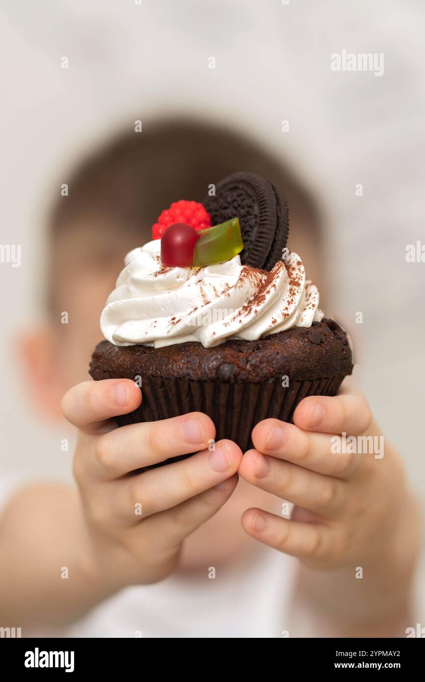 Close-up cake in the hands of a child Stock Photo