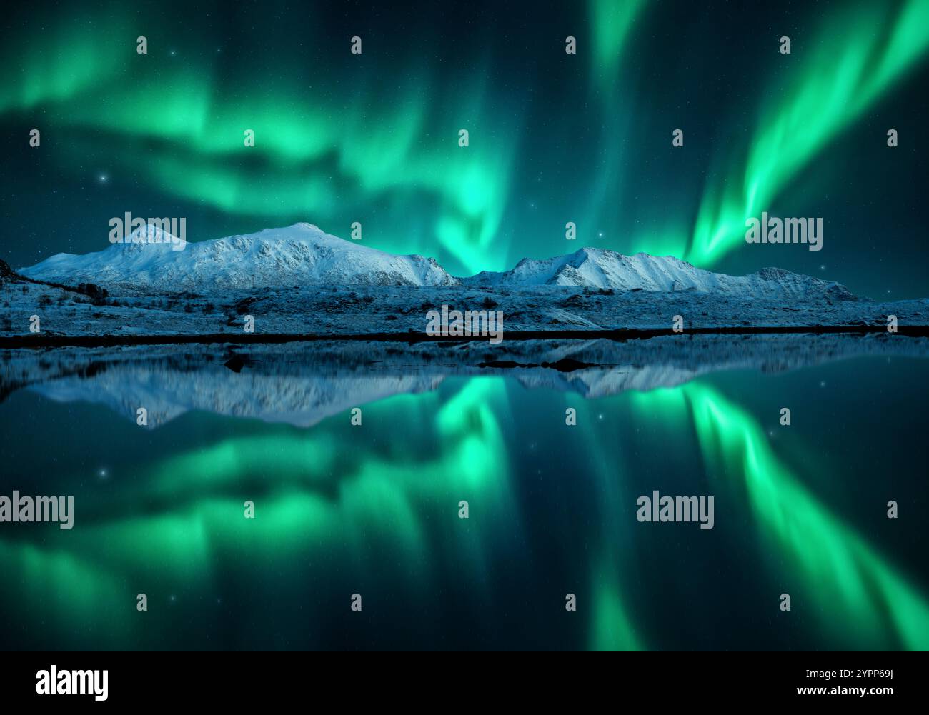 Northern lights over the snowy mountains, reflection in water Stock ...
