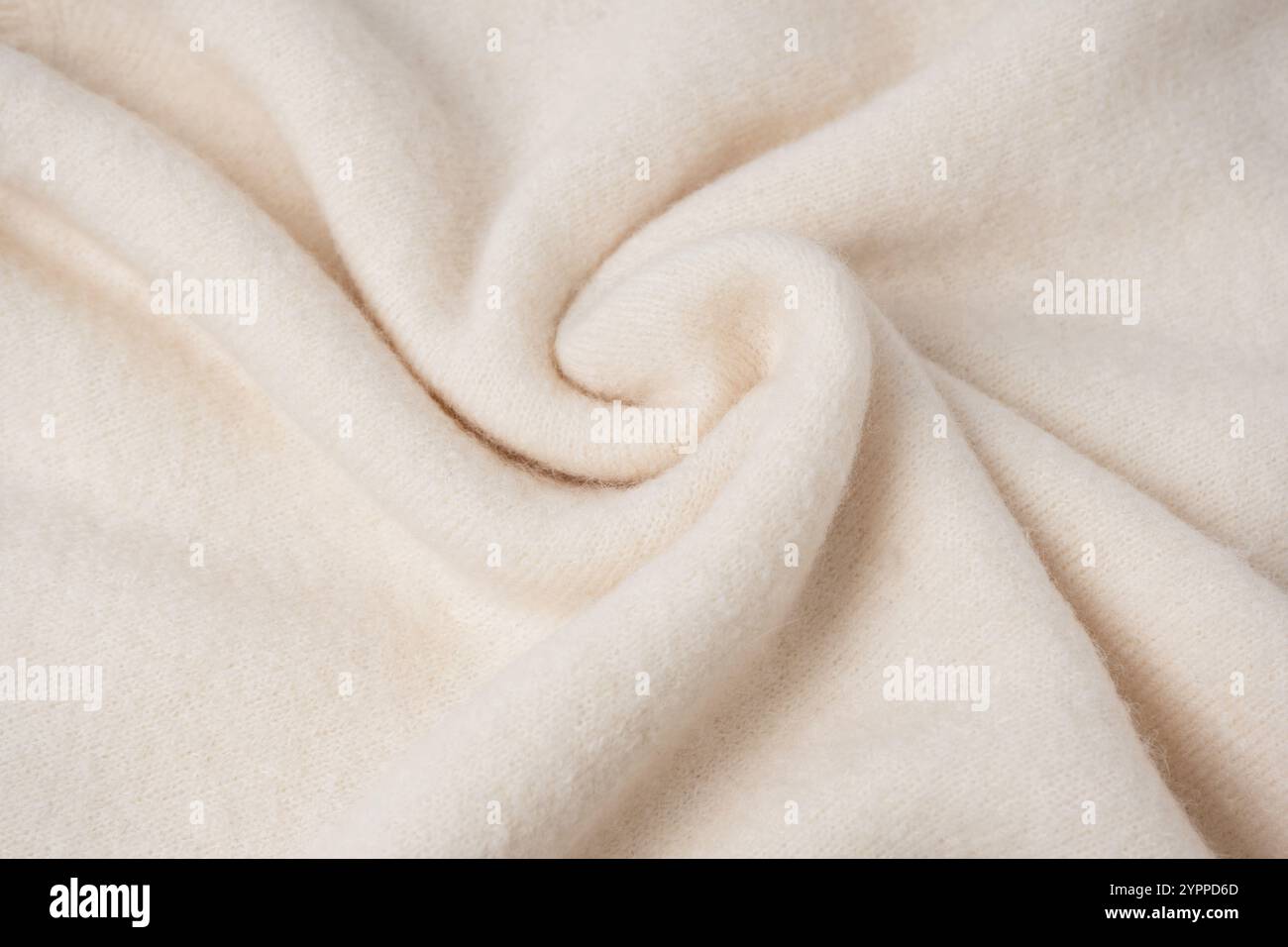 Beige sweater texture as a background. Top view. Stock Photo